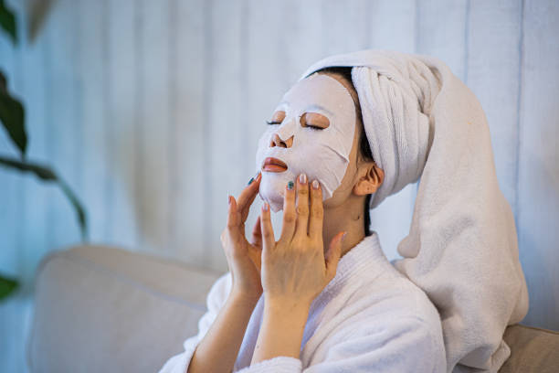 Woman with purifying mask on her face